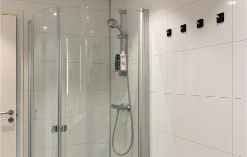a bathroom with a shower with a shower head at 5 Bedroom Gorgeous Home In Vikedal in Vikedal