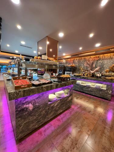 a kitchen with purple lighting in a restaurant at ON ALETA ROOM designed for adults in Almuñécar