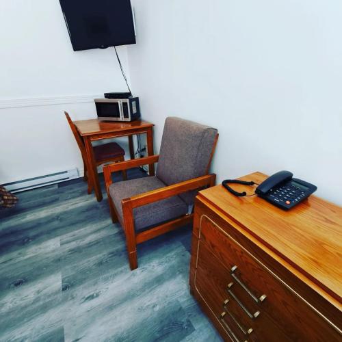 TV a/nebo společenská místnost v ubytování Motel Bonsoir