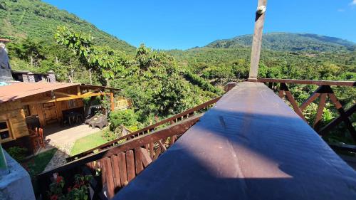 a balcony of a house with a view of a mountain at Casa Katok in Sonsonate