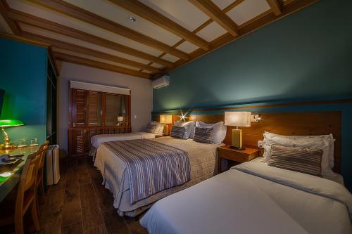 Katil atau katil-katil dalam bilik di Hotel Britanico Express