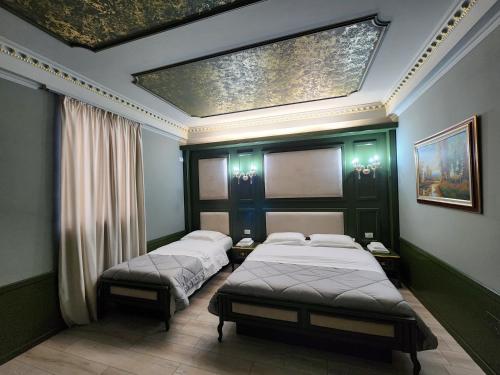 Postel nebo postele na pokoji v ubytování Hotel Lotus