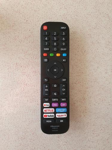 a remote control sitting on top of a table at Ferienwohnung am Stadion Bochum Grumme in Bochum