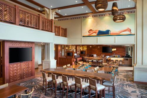a dining room with a large table and chairs at Residence Inn by Marriott Maui Wailea in Wailea