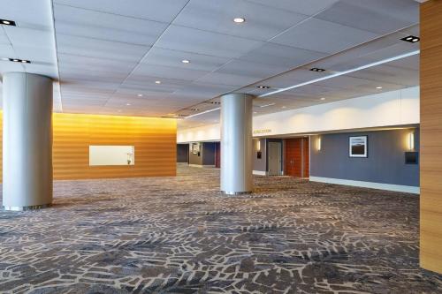 a large lobby with a large room with columns at The Westin Galleria Dallas in Dallas