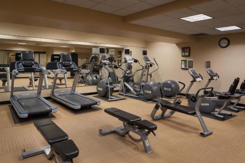 a gym with a lot of treadmills and exercise bikes at The Davenport Tower, Autograph Collection in Spokane