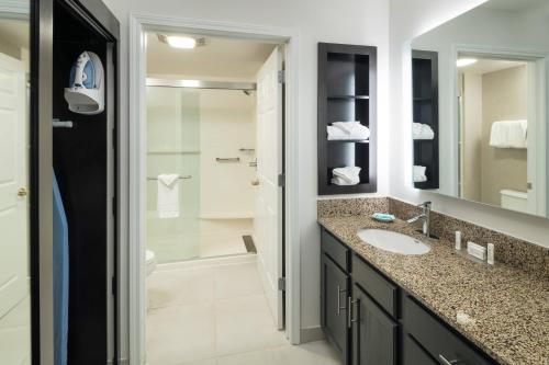 a bathroom with a sink and a shower at Residence Inn Boston Westford in Westford