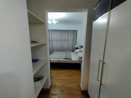 a small room with a bed in a bedroom at San Stefano Grand Plaza in Alexandria