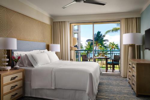 a hotel room with a bed and a balcony at The Westin Ka'anapali Ocean Resort Villas North in Lahaina