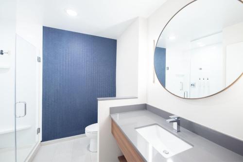 a bathroom with a sink and a mirror at Fairfield by Marriott Inn & Suites Kingsport in Kingsport