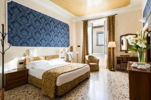 Postel nebo postele na pokoji v ubytování Hotel Silla