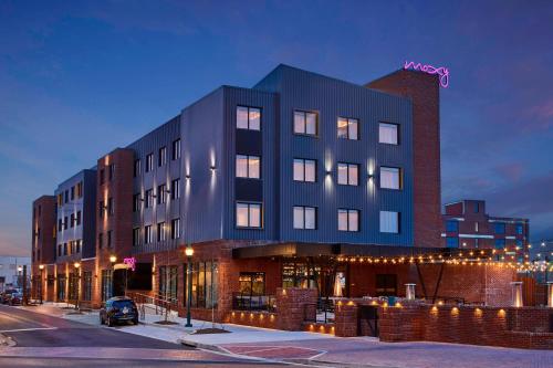 a building on a street next to a street at Moxy Chattanooga Downtown in Chattanooga