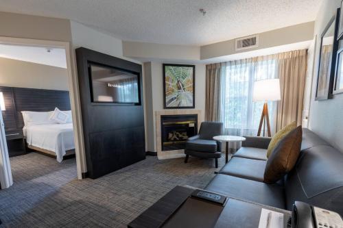 a living room with a couch and a fireplace at Residence Inn by Marriott Princeton at Carnegie Center in Princeton