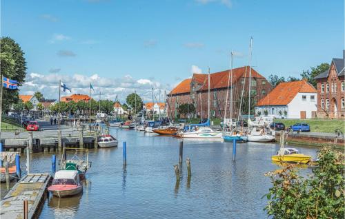 a bunch of boats are docked in a harbor at 2 Bedroom Lovely Home In Tönning in Tönning