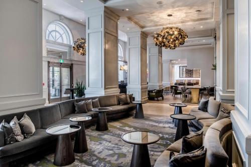 a lobby with couches and tables in a building at The Westin Nova Scotian in Halifax