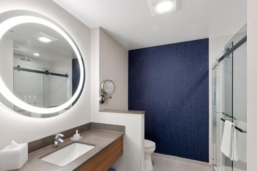 a bathroom with a sink and a mirror at Fairfield by Marriott Inn & Suites San Francisco Pacifica in Pacifica