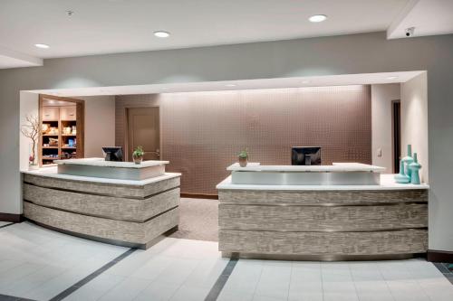 a lobby of a hotel with a reception counter at Residence Inn by Marriott Portsmouth in Portsmouth