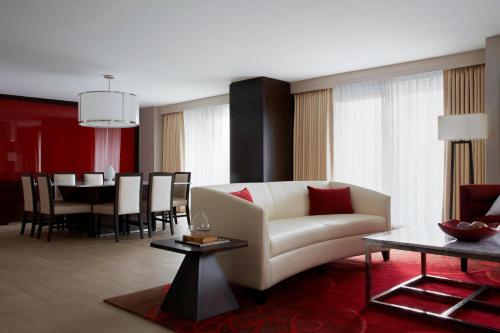 a living room with a couch and a table at Marriott Marquis Washington, DC in Washington