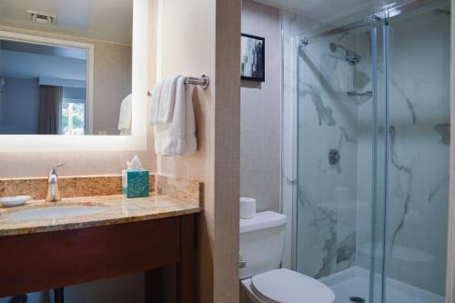 a bathroom with a shower and a sink and a toilet at Residence Inn La Mirada Buena Park in La Mirada