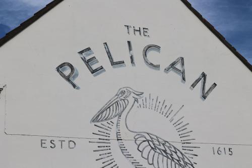 a sign that says the elixir with a bird on it at The Winford Retreat in Winford