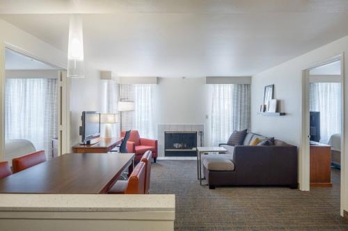 a living room with a couch and a table at Residence Inn Portland Hillsboro in Hillsboro