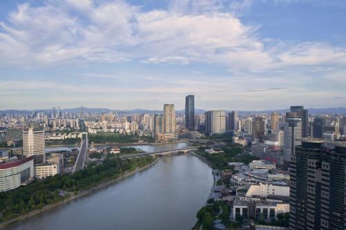 a view of a river in a city with buildings at Ningbo Marriott Hotel in Ningbo