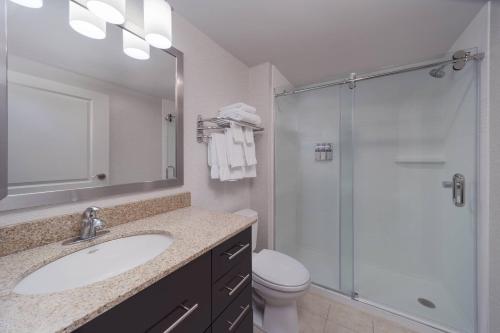 a bathroom with a sink and a glass shower at TownePlace Suites by Marriott Providence North Kingstown in North Kingstown