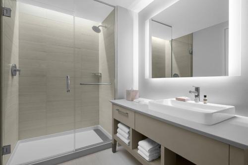 a bathroom with a sink and a shower at Element Miami Brickell in Miami