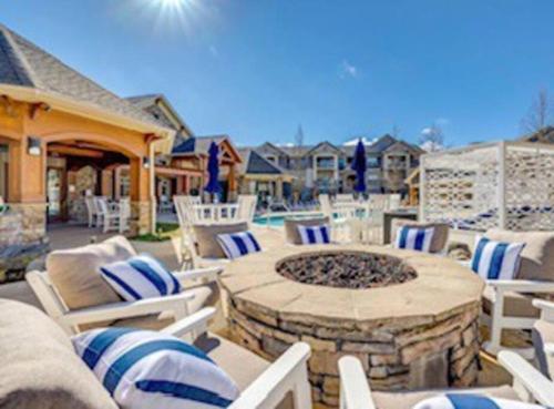 a outdoor patio with chairs and a fire pit at South Charlotte Most Wanted in Charlotte