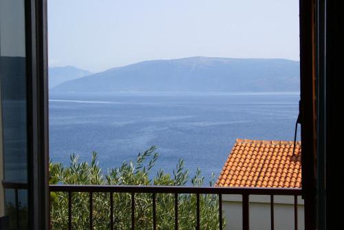 a view of the water from a window at Apartments by the sea Valun, Cres - 386 in Valun