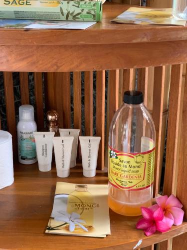 a bottle of liquid sitting on top of a shelf at TAMANU LODGE in Punaauia