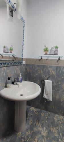 a bathroom with a sink and a mirror at Casa Angela in Las Fraguas