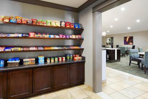a lobby with a counter with food on it at Residence Inn Temple in Temple