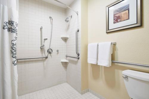 a bathroom with a shower and a toilet at Residence Inn Temple in Temple