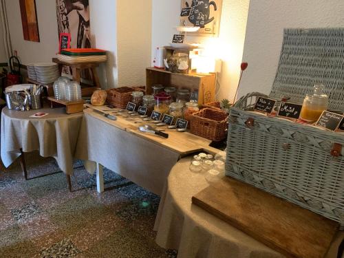 a room with two tables with baskets on it at Initial by balladins, Hôtel Restaurant Broisin in Aix-les-Bains