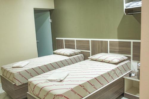 Hotel Tenda Obsessionにあるベッド