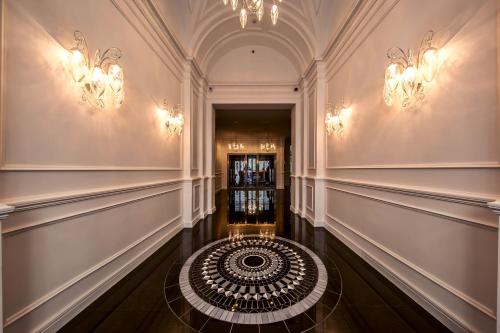a hallway with a spiral staircase in a building at Prestige Hotel Budapest in Budapest