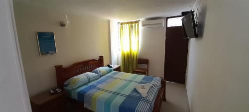 Un ou plusieurs lits dans un hébergement de l'établissement Hotel Danes Barranquilla