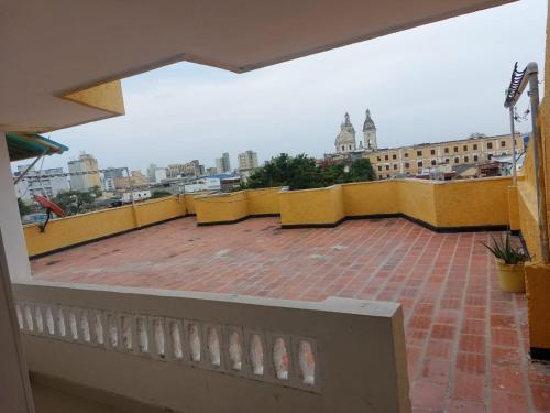a balcony with a view of a city at Hotel Danes Barranquilla in Barranquilla