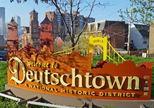 a sign for a park with a city in the background at Family-Friendly 4BR Retreat Sleeps 12, Private Yard, Garage, Close to Stadiums, Casino & Downtown in Pittsburgh