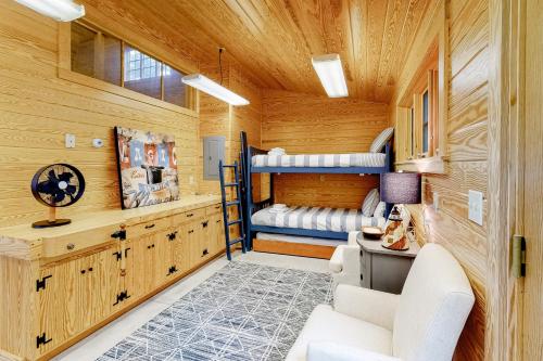 a room with two bunk beds in a house at Barn at the Beach - Main House in Georgetown