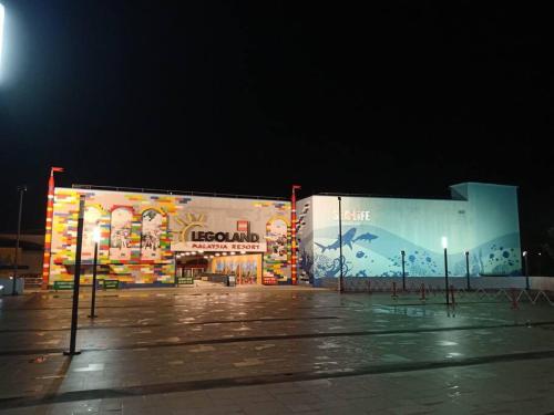 a large building with a painting on it at night at Walk to Legoland * D'Pristine * 2BR Lake View #6 in Nusajaya