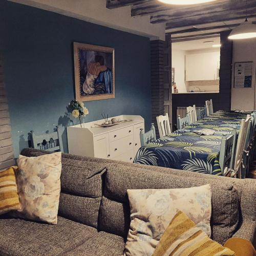 a living room with a couch and a bedroom at Casa rural "Garnacha de Borja" guest home in Borja