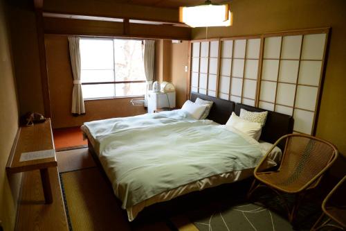 Tempat tidur dalam kamar di Kogakuro