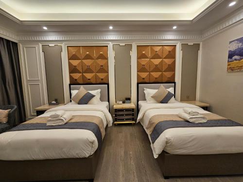Katil atau katil-katil dalam bilik di Swan Lake Hotel