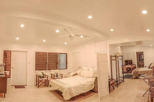 a bedroom with a bed and a ceiling fan at Harmonic Haven in Witta