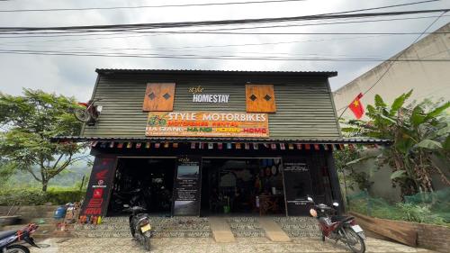 a store front of a store with motorcycles parked outside at Style Motorbikes Homestay Ha Giang in Ha Giang