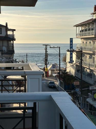 a view of the ocean from the balcony of a building at Apartments Villa Effie in Paralia Katerinis