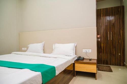 Katil atau katil-katil dalam bilik di Hotel Green Apple