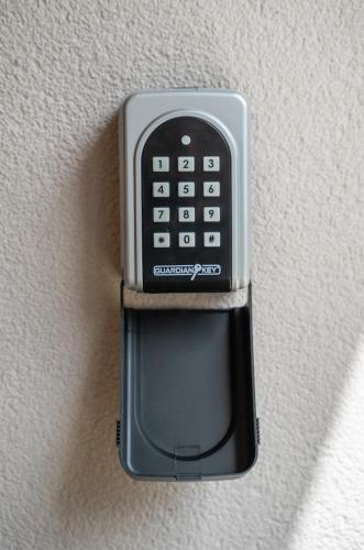 a cell phone is hanging on a wall at Marea DeLuxe Apartments in Kotor